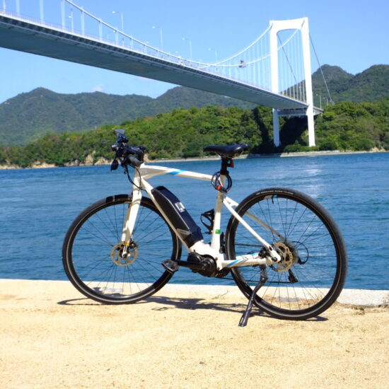 Bicycle in one of the sand beaches of Shimanami Kaido cycling route