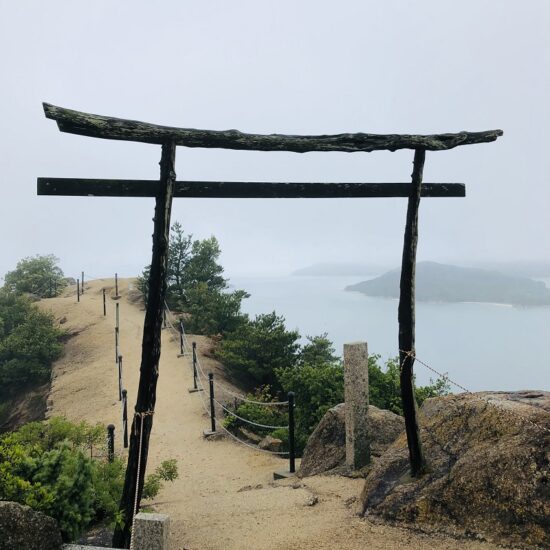 Torii gate located on top of a hill with sea background, Shodoshima