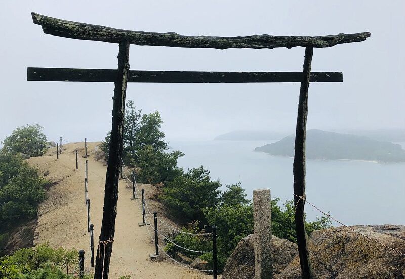 Torii gate located on top of a hill with sea background, Shodoshima