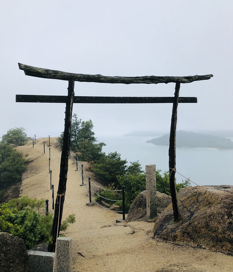 Torii gate located on top of a hill with sea background, Shodoshima